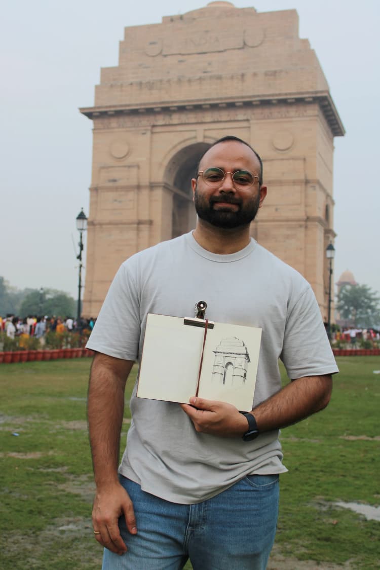 photo of the artist with his drawing